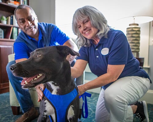 caregiver and resident smiling