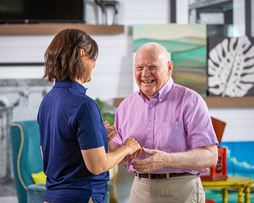 caregiver dancing with resident